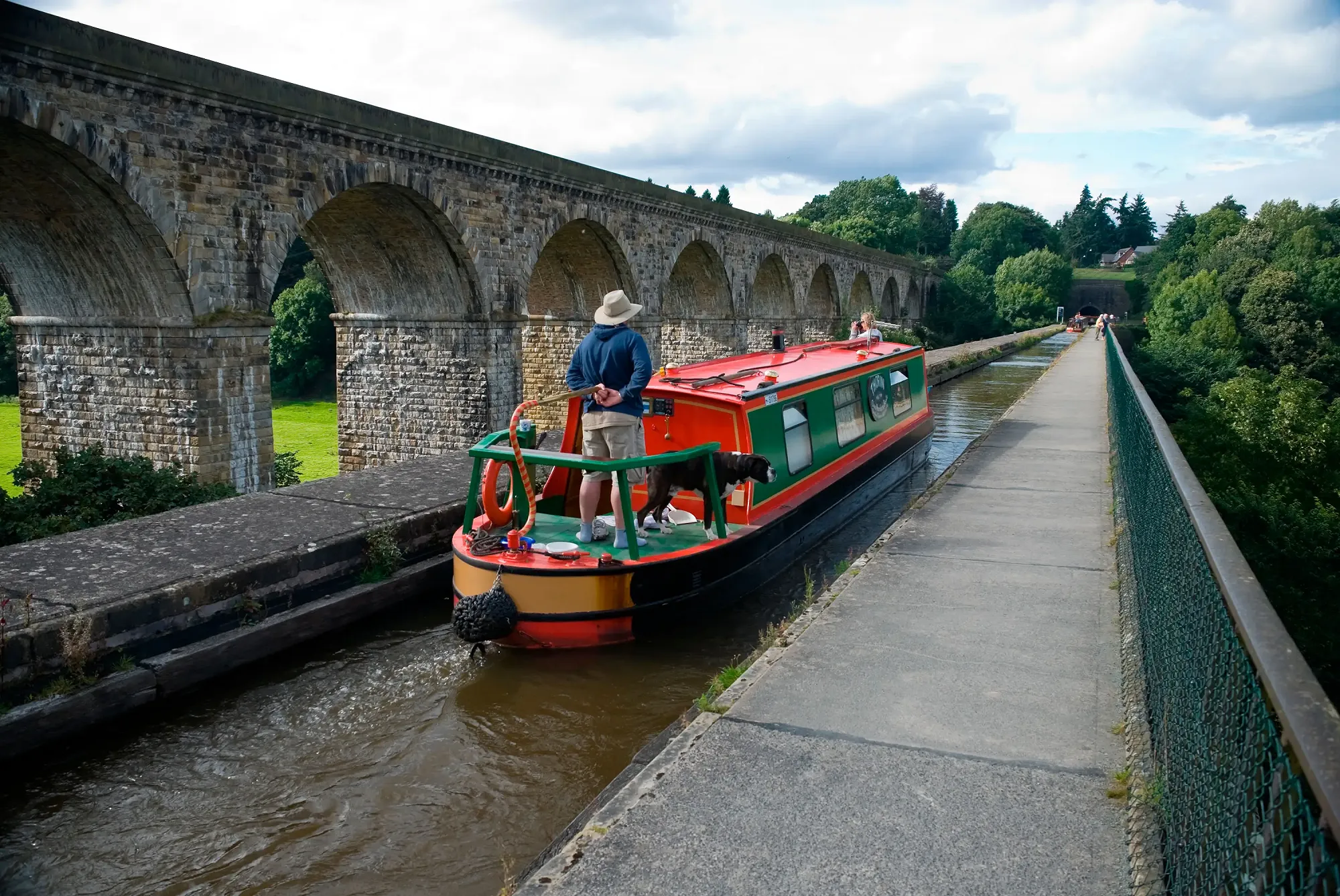 Narrowboat thorin with a family onboard crossing Chirk aqueduct on a short-term narrowboat rental