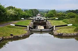 A holiday barge making it's way up Caen Hill Locks on the Kennet & Avon Canal