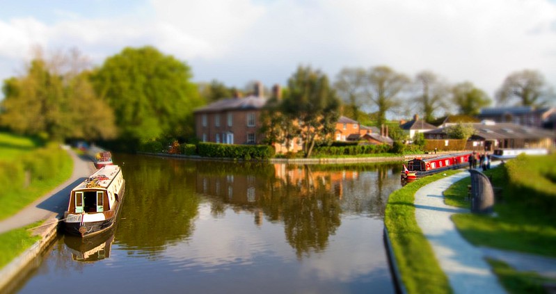 Junction near Ellesmere Wharf on the Llangollen canal, with narrowboats moored on the canal.